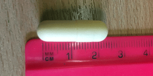 Coating of elongated capsule 25mm in Caleva coater drier